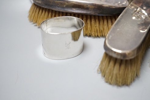 Six assorted George V silver mounted glass toilet jars, a similar brush set, a silver napkin ring and a large silver hip flask?, London, 1919, 17.3cm, 12.5oz.